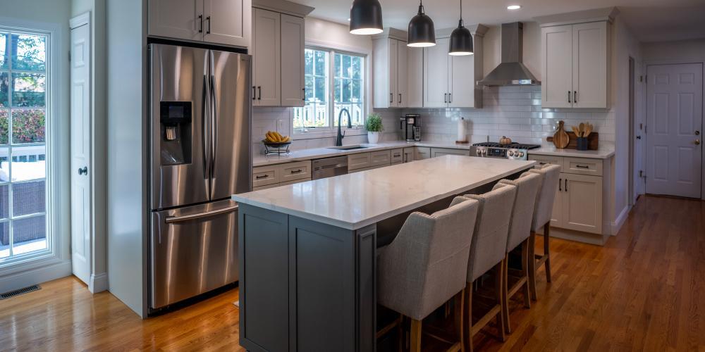 Completed kitchen remodel featuring modern energy-efficient stainless steel appliances and custom cabinetry.