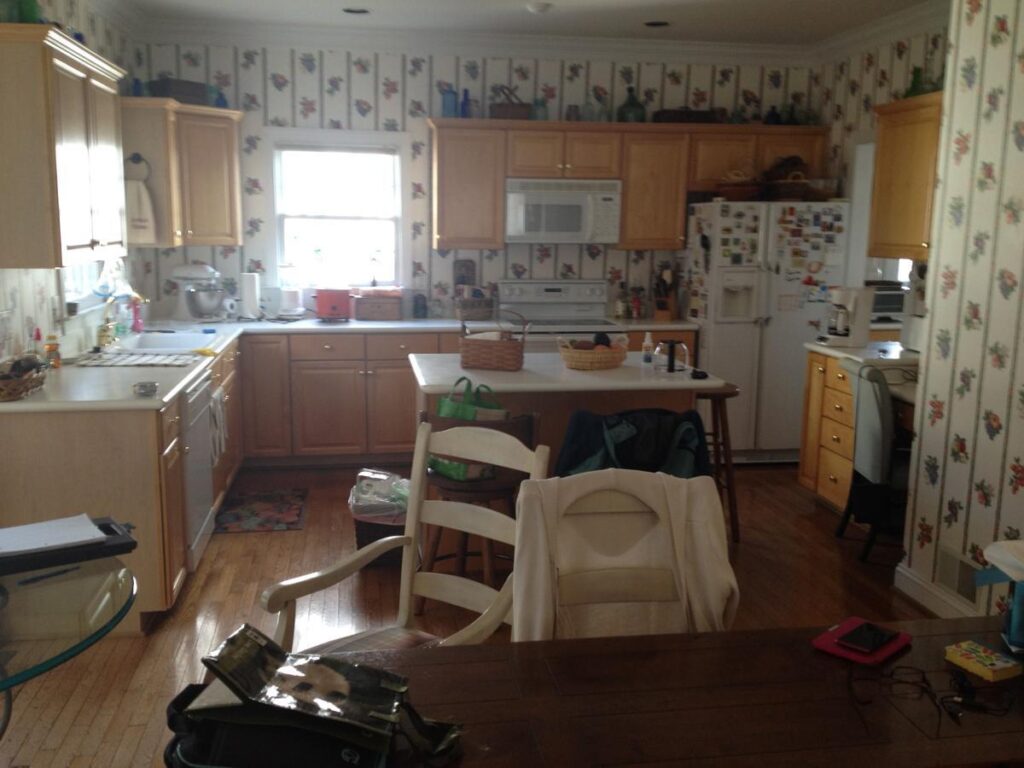 Crowded family kitchen with an outdated layout that no longer meets the needs of a growing household.