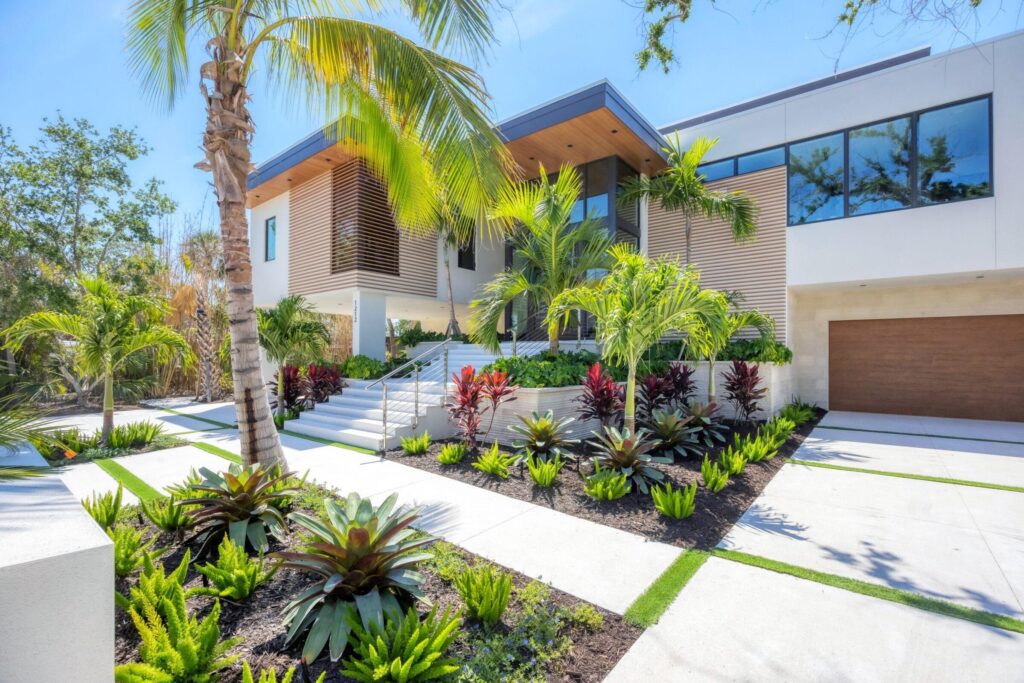 Modern Florida home exterior with durable building materials and tropical landscaping