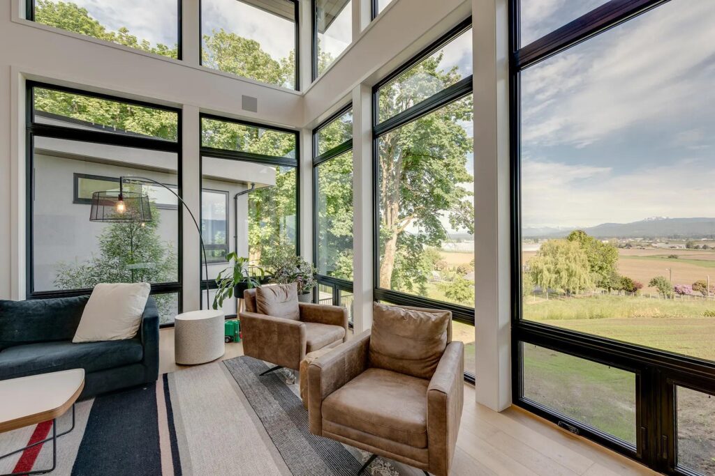 Bright energy-efficient home addition with large windows and modern finishes.