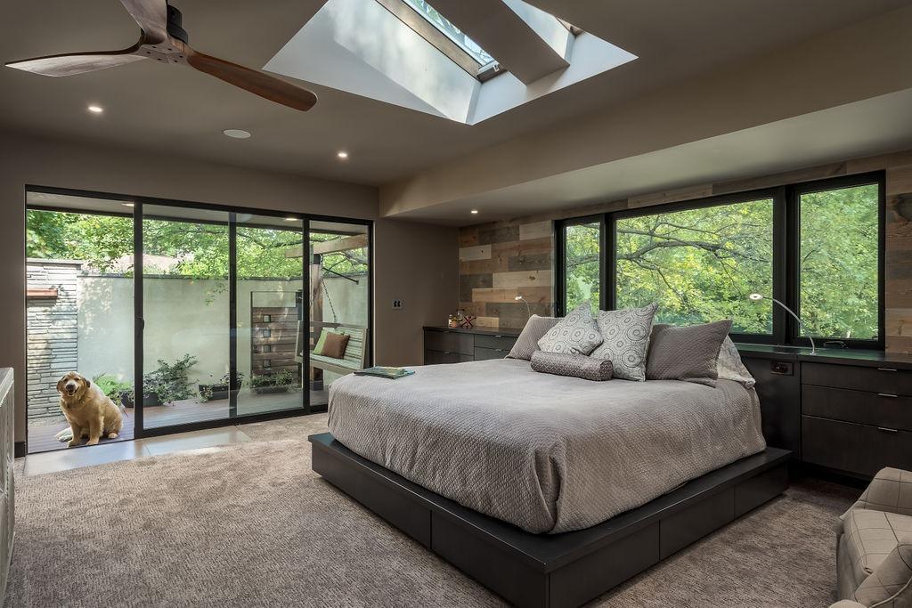 Spacious bedroom addition designed to match the home's original architecture.