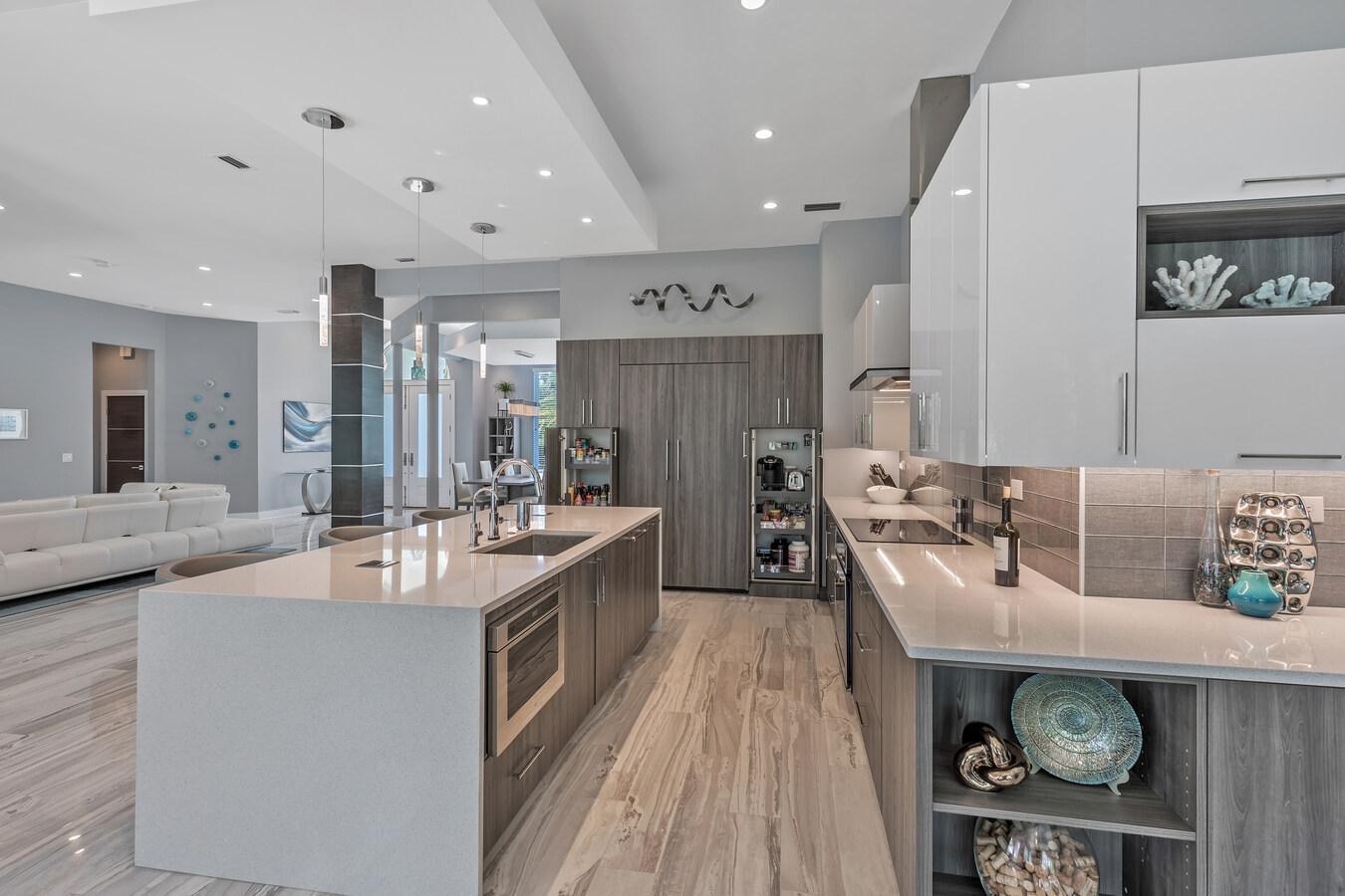 Functional modern kitchen layout with island and organized storage in a Florida home