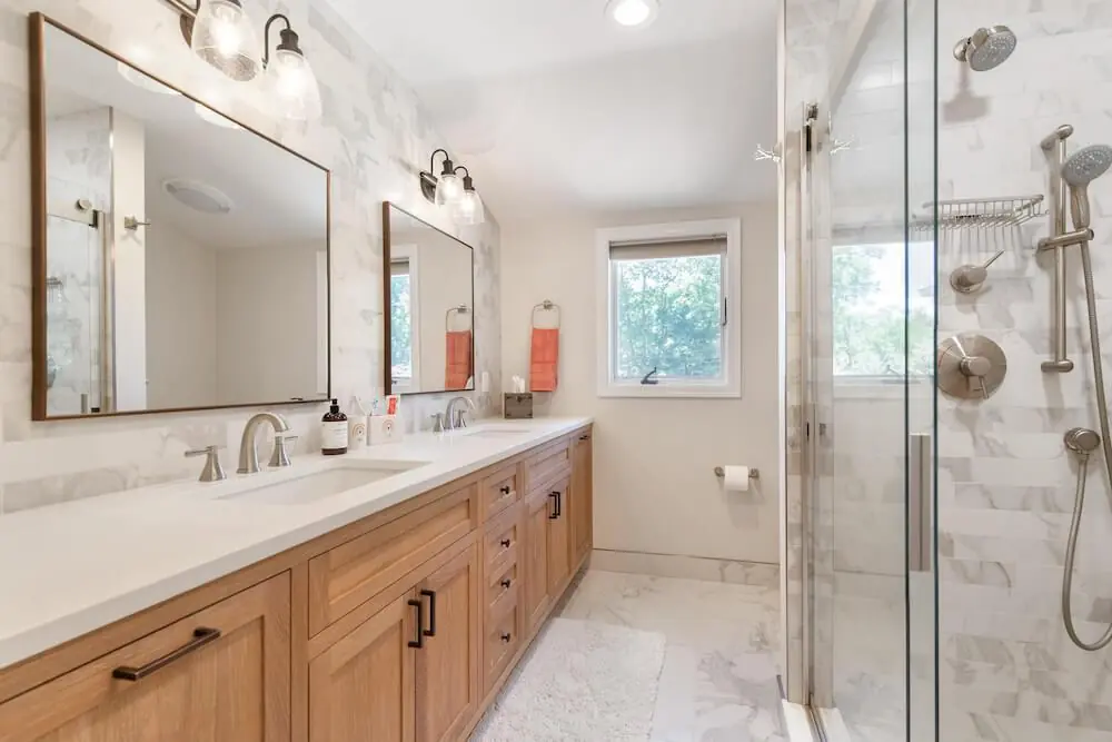 Modern Florida bathroom with moisture-resistant tile and glass shower enclosure