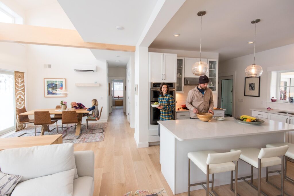 Family enjoying a spacious open-concept kitchen with a large island.