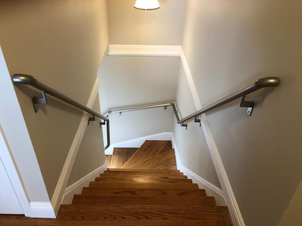 Safe home staircase with secure handrails and improved lighting for family members