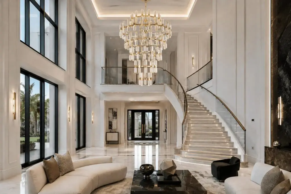Elegant dining room showcasing a sculptural chandelier above a contemporary dining table.